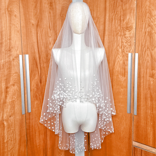 Front view of the 3D silk blossom wedding veil with blusher draped on a mannequin, showcasing the lightweight Whisper Tulle.