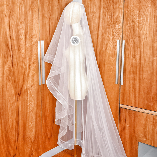 Side view highlighting the structured layers of a cathedral length double horsehair wedding veil.