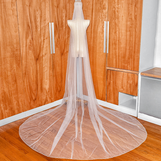 Sheer bridal tulle pearl trim wedding veil in cathedral length, displaying the high-quality transparency and soft texture.