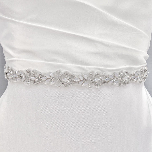 Silver rhinestone and pearl bridal belt with intricate crystal beadwork displayed on a bridal mannequin.