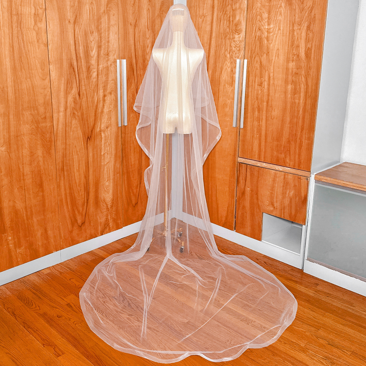 Back view of a cathedral length wedding veil featuring 1 1/2" horsehair trim and a blusher.