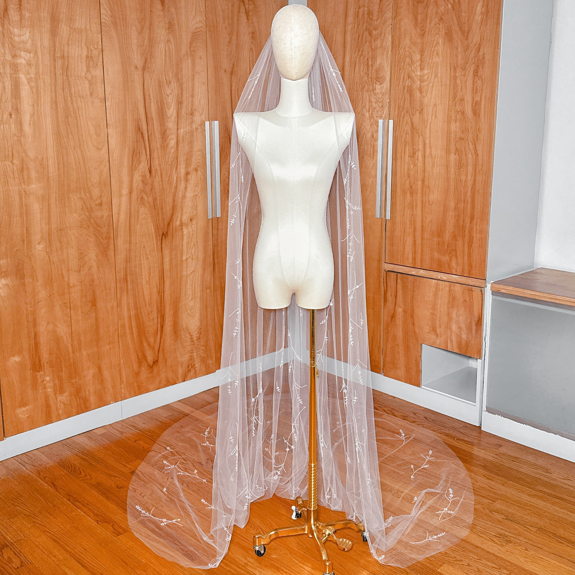 White cathedral length 3D floral embroidered veil with crystals and hand-sewn petals.