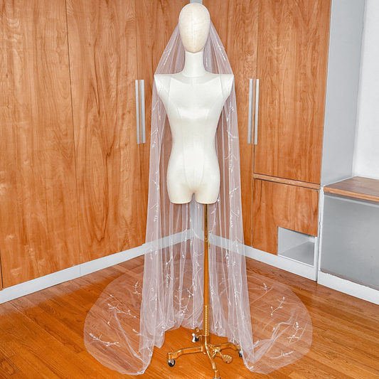 White cathedral length 3D floral embroidered veil with crystals and hand-sewn petals.