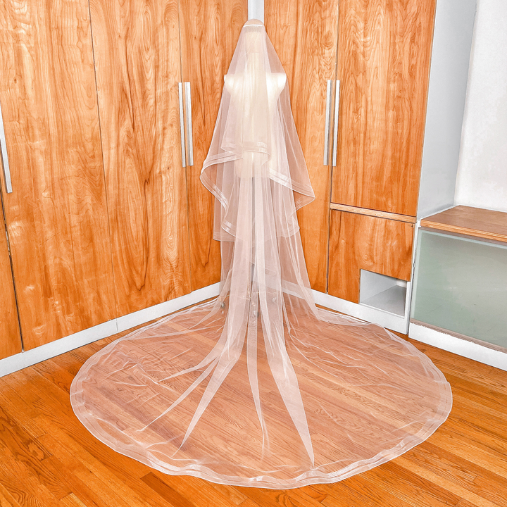 Rear view of a cathedral length two tier veil highlighting the double horsehair trim layered effect.