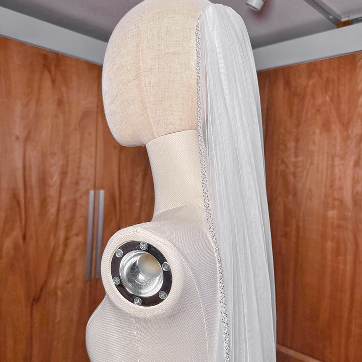 Sheer soft tulle cathedral length wedding veil showcasing a premium beaded edge border.