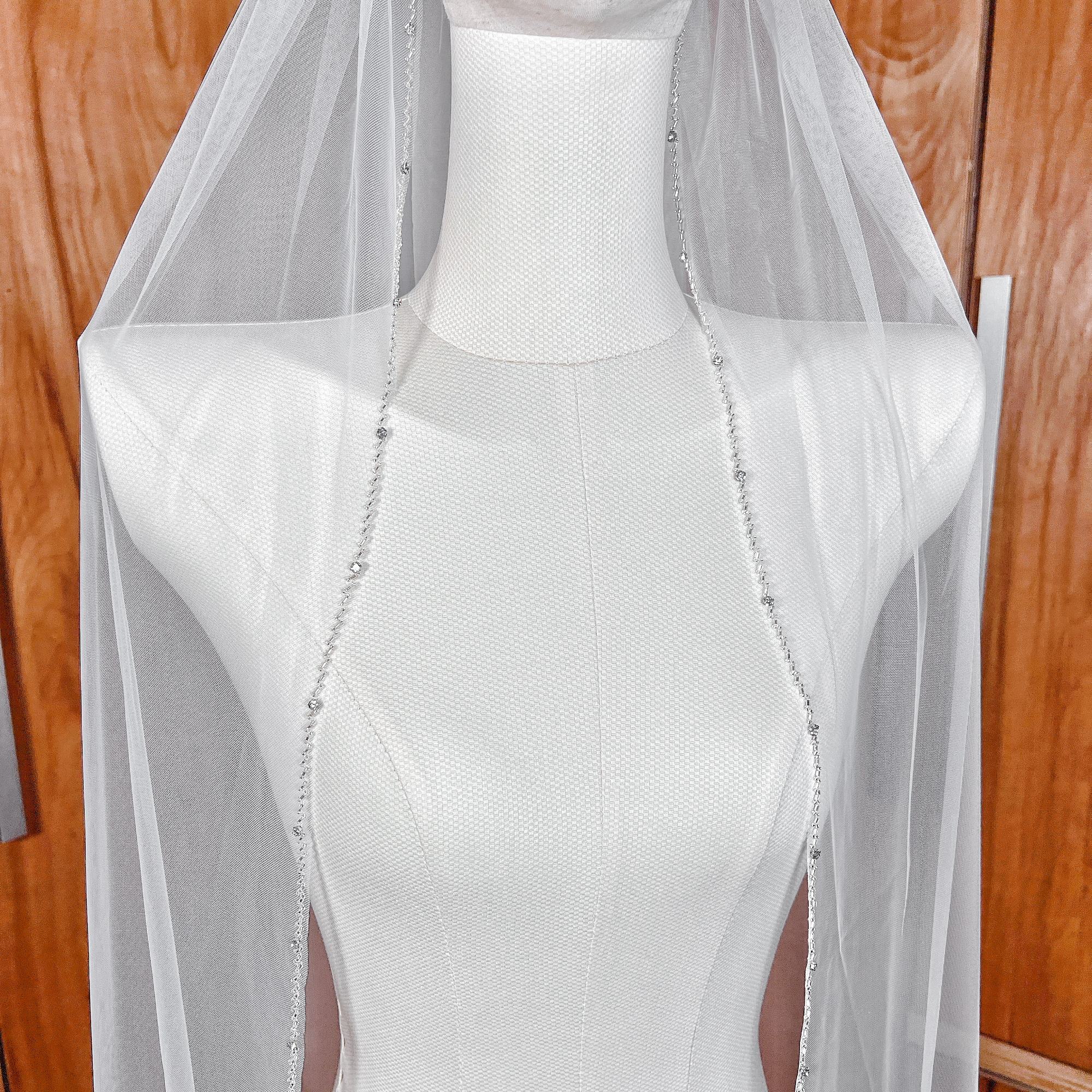 Classic ivory wedding veil with a beaded edge.