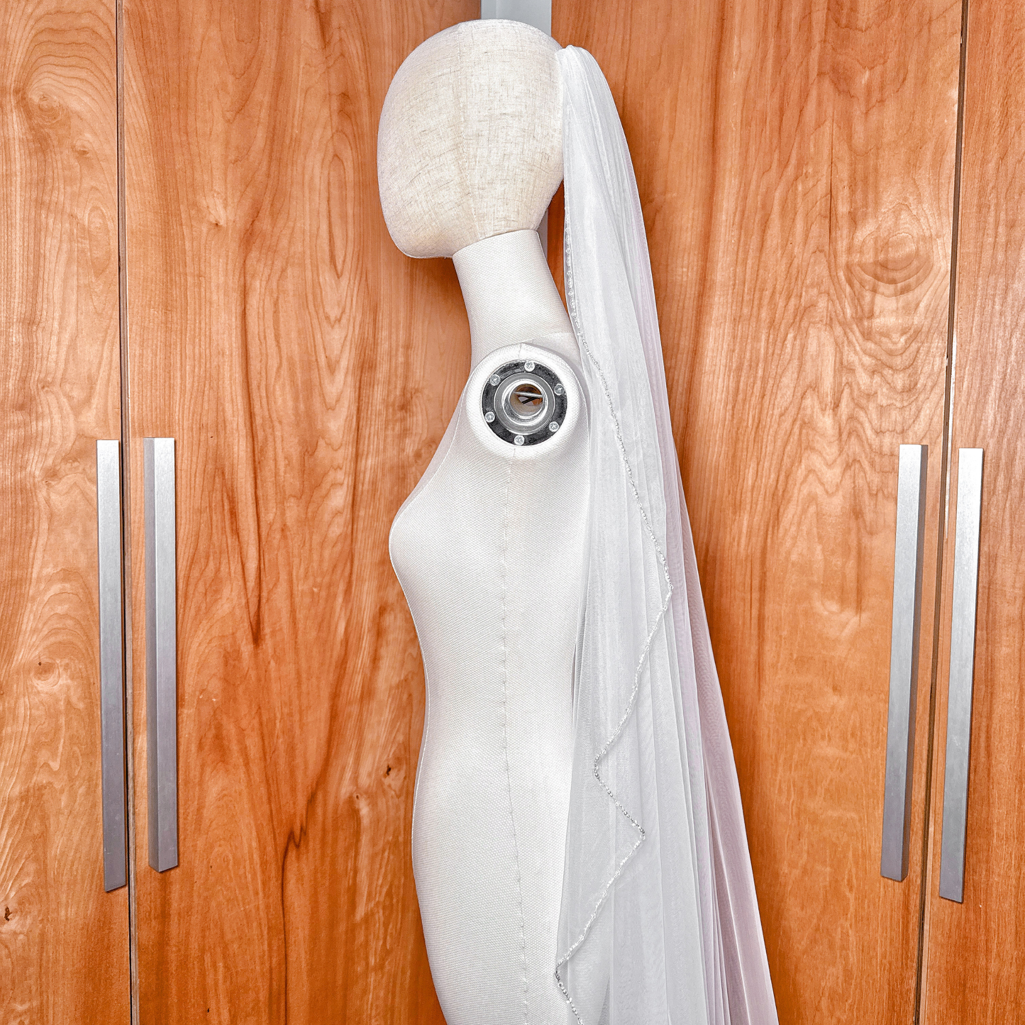 Soft bridal tulle on a cascading beaded edge cathedral length wedding veil.