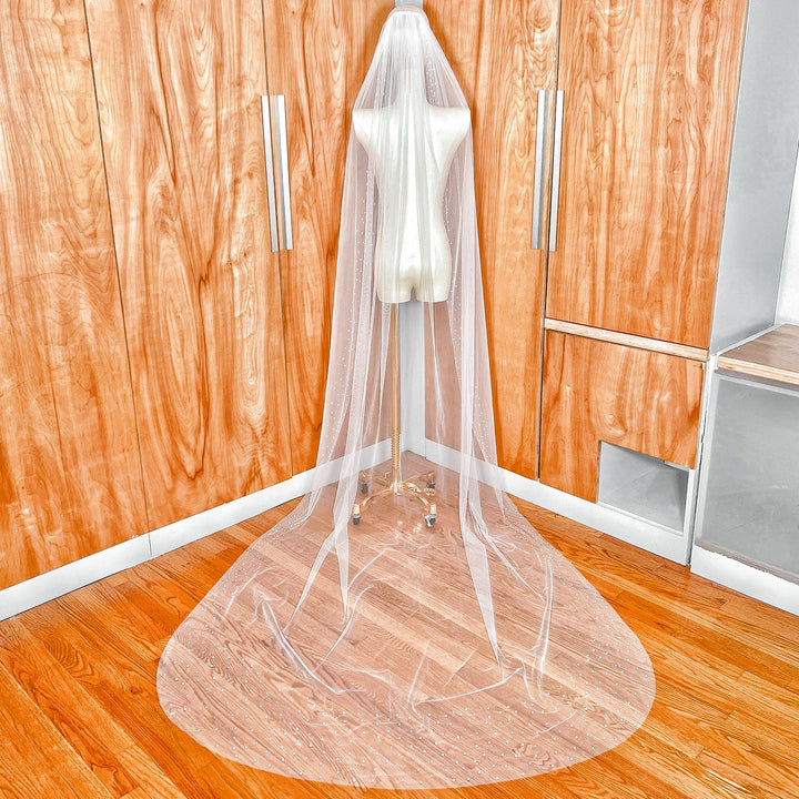 Back view showing the full cathedral length of the Scattered Pearl Edge Wedding Veil with shimmering pearls scattered across the sheer tulle.