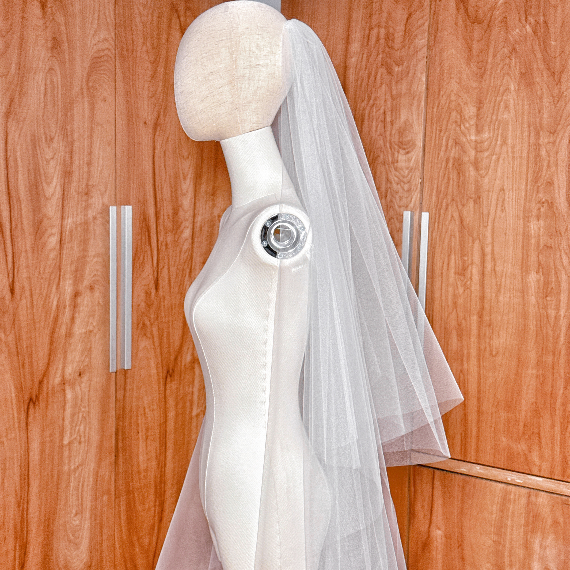 Long cathedral-length wedding veil featuring two tiers of sheer tulle and a classic blusher layer.