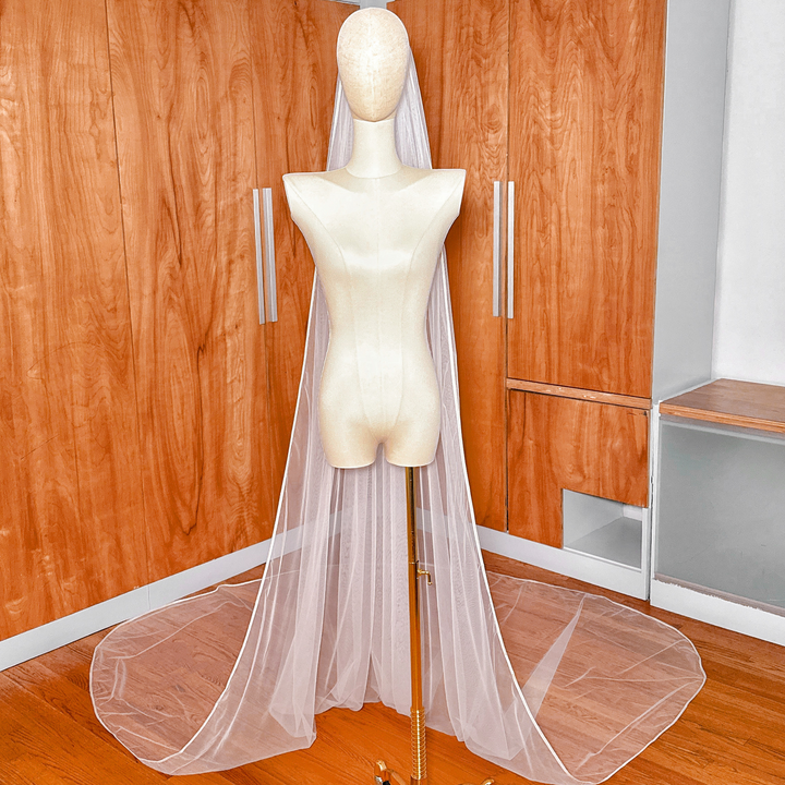 Classic ivory single tier ribbon edge wedding veil in cathedral length.
