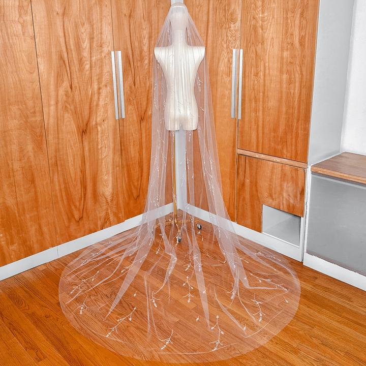Back view of a cathedral length 3D floral embroidered wedding veil with crystals.