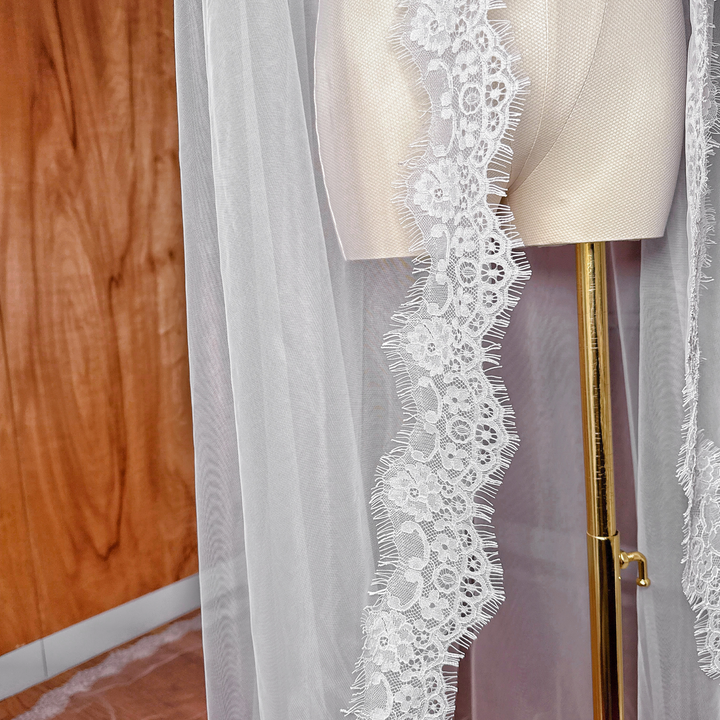 Close-up of the intricate French Chantilly lace scalloped edge on a cathedral length mantilla veil.