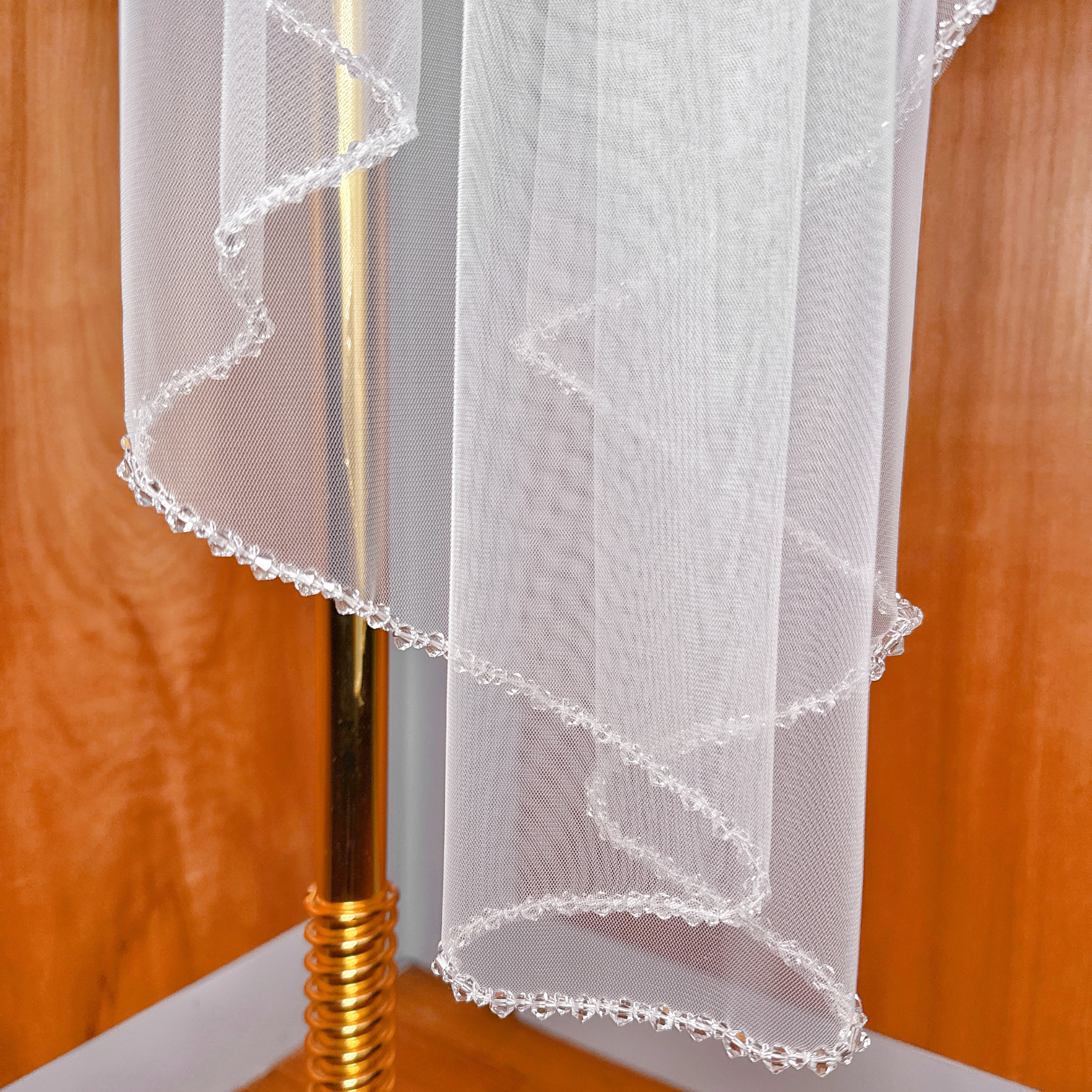 Dazzling crystal edge on a waltz length mantilla wedding veil.