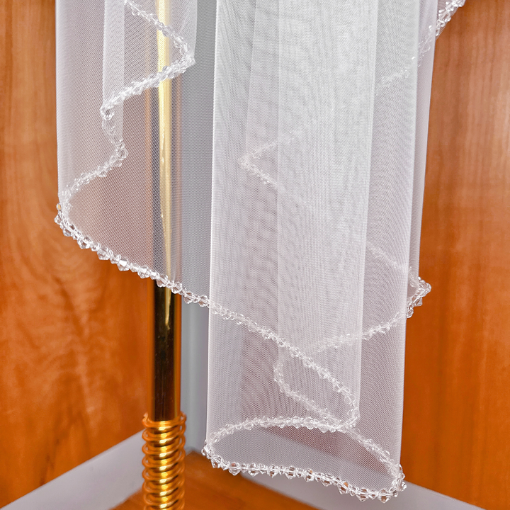 Dazzling crystal edge on a waltz length mantilla wedding veil.