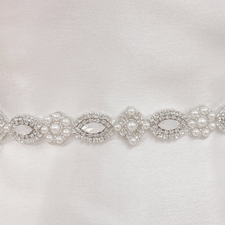 Close-up detail of the hand-stitched pearls and rhinestones on the Vintage Art Deco beaded wedding belt.