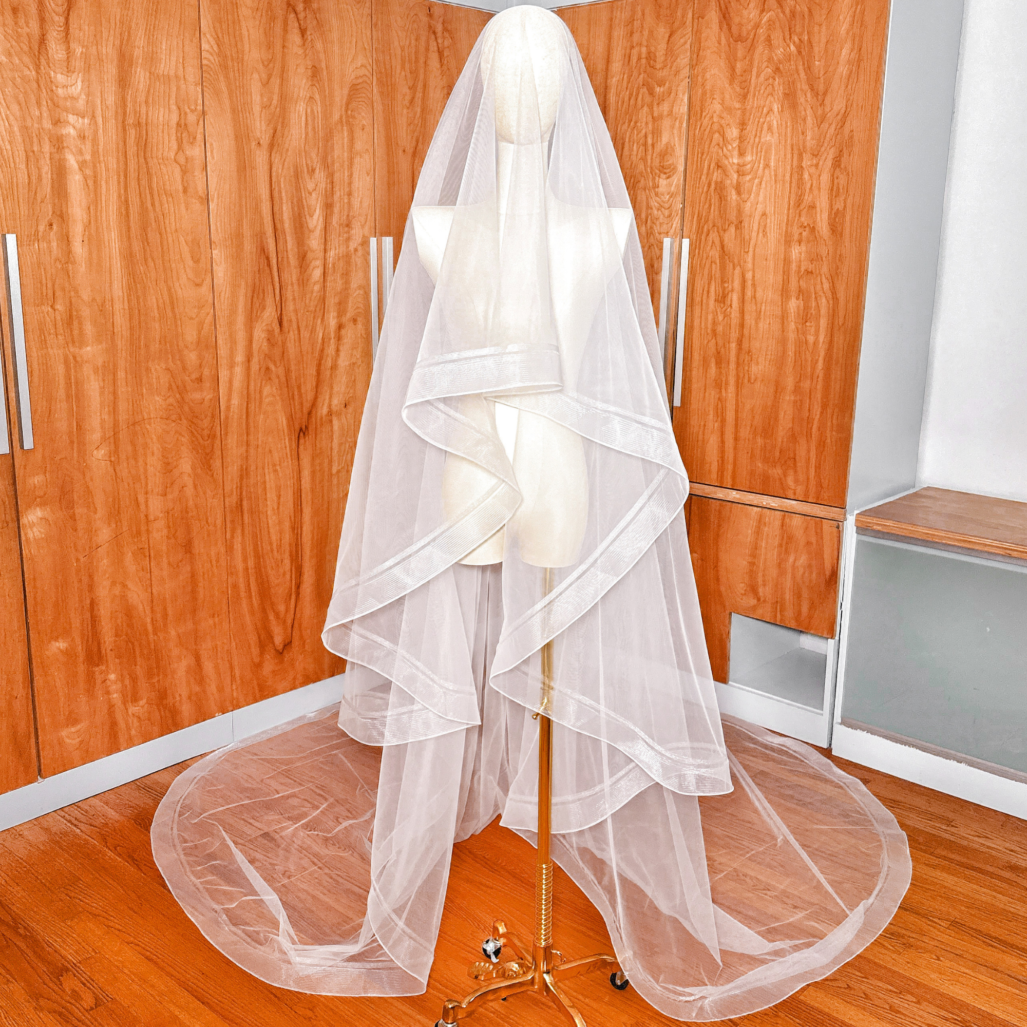 Cathedral length double horsehair wedding veil displayed on a bridal mannequin.