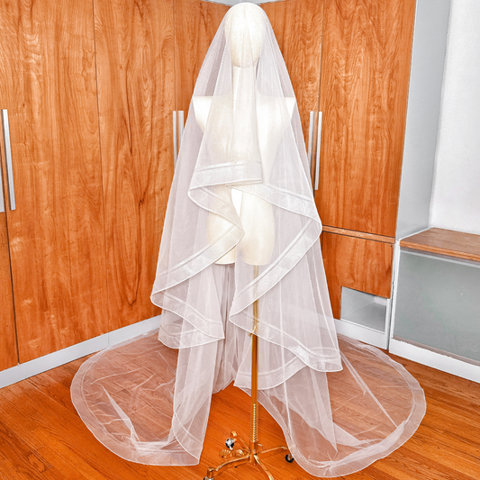 Cathedral length double horsehair wedding veil displayed on a bridal mannequin.