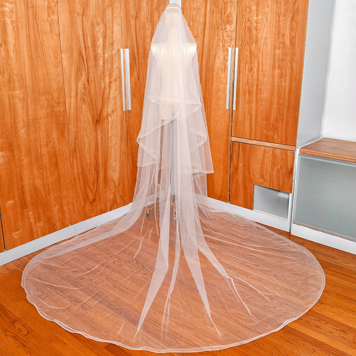 Back view of a cathedral length double horsehair wedding veil on a mannequin.