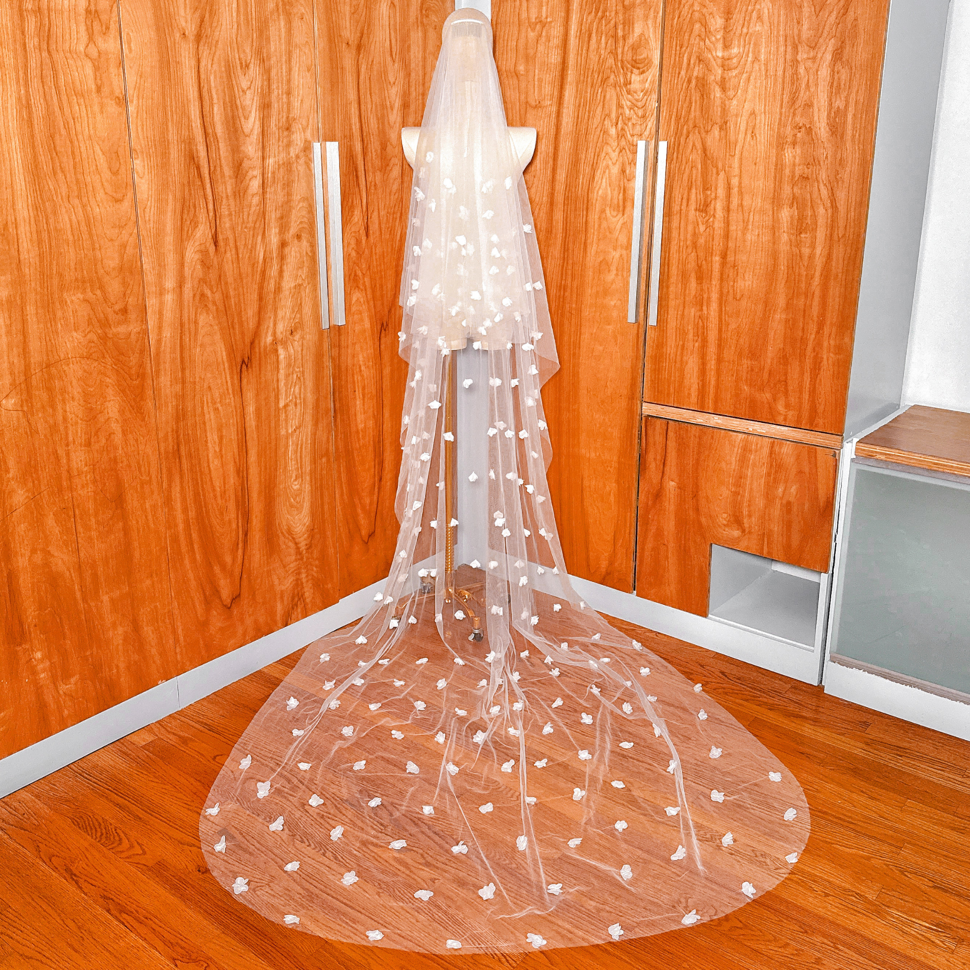 Elegant cathedral length two tier 3D floral wedding veil with blusher for bridal styling.