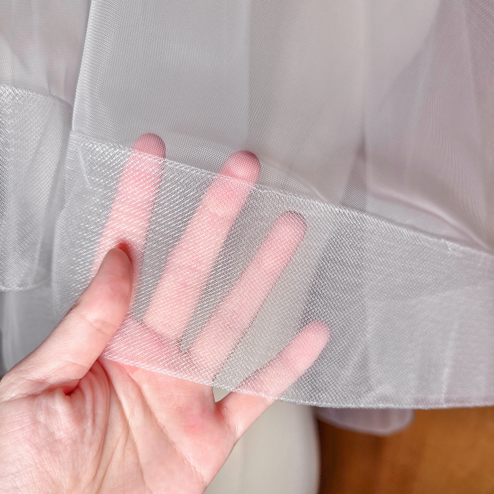 Close-up of the 2.5 inch horsehair edge on an elbow length two tier wedding veil with blusher.