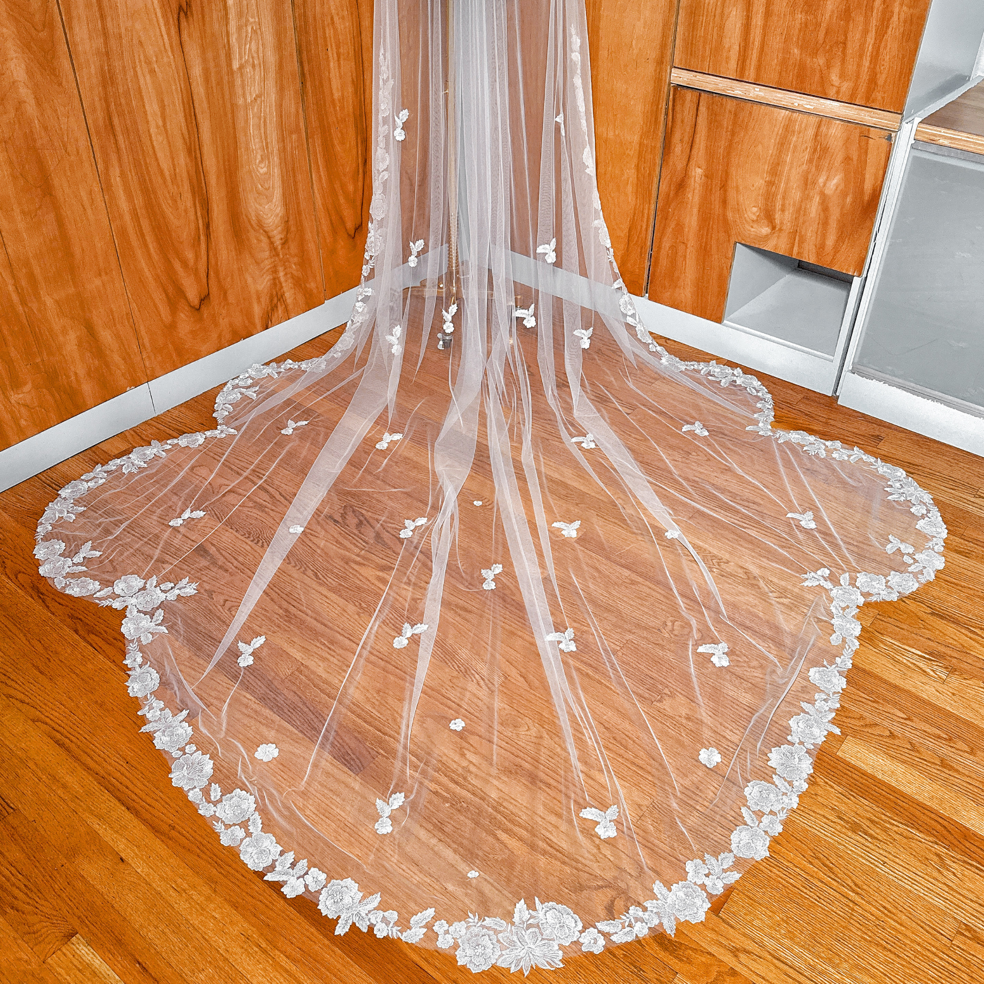 High-resolution texture shot of the Scalloped Lace Edge Royal Cathedral Veil fabric and edging.