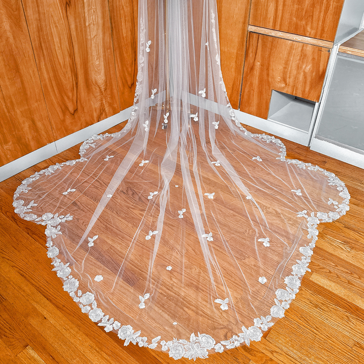 High-resolution texture shot of the Scalloped Lace Edge Royal Cathedral Veil fabric and edging.