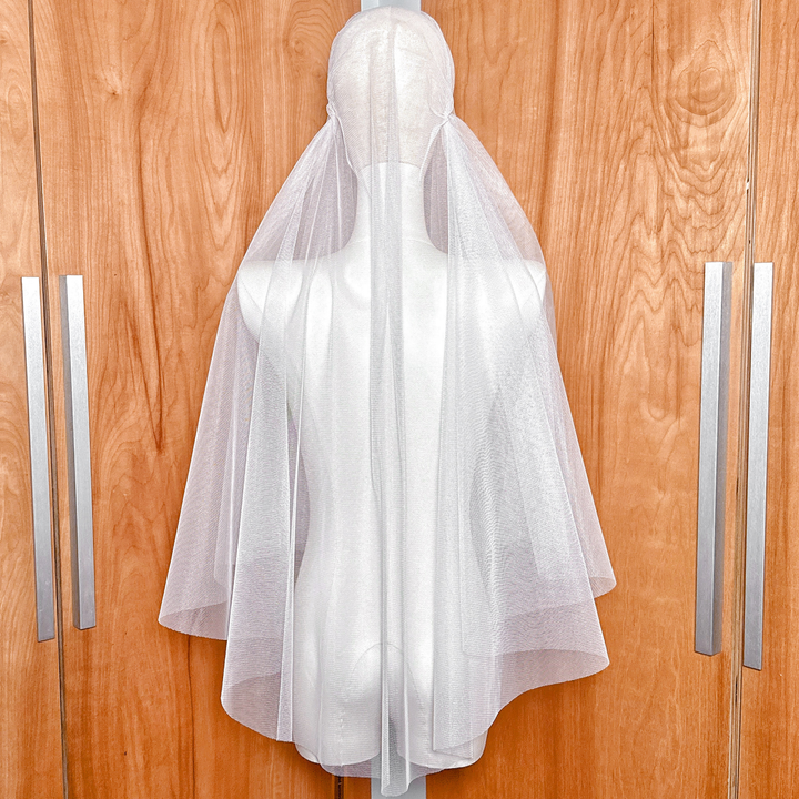 Back view of an ivory tulle juliet cap veil showing the cap detail.