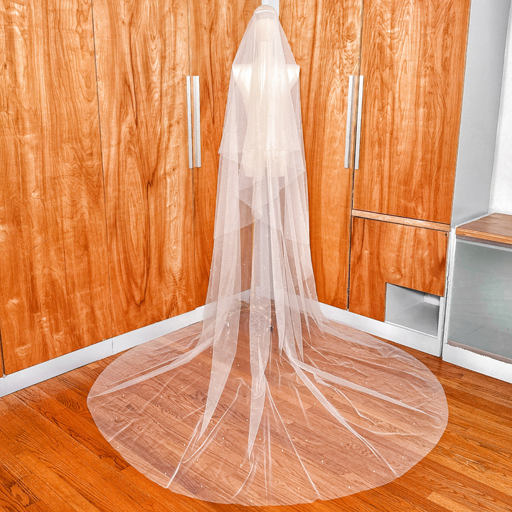 Ivory cathedral length two tier scattered pearl wedding veil with a soft drop veil blusher.