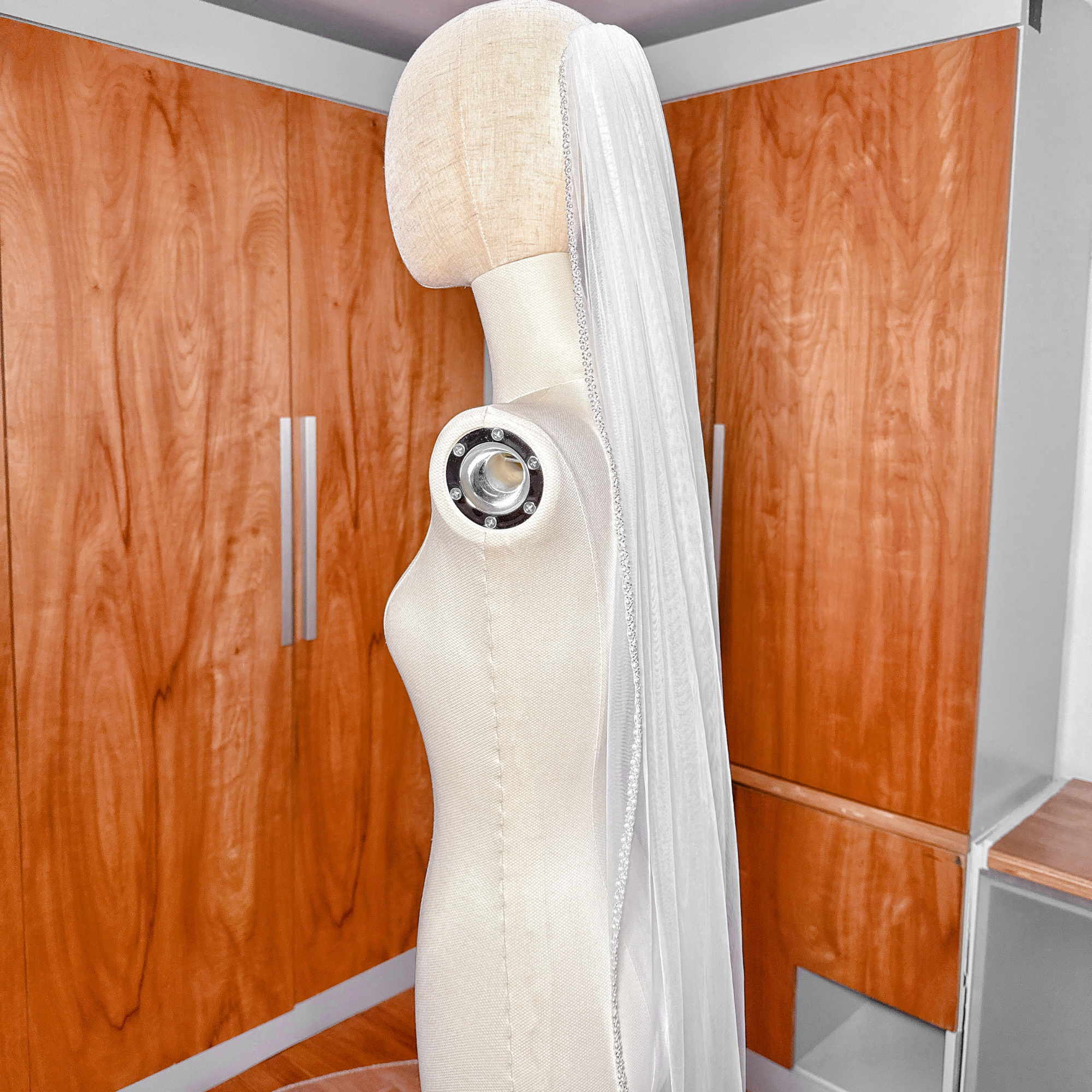 Cathedral length luxury wedding veil with beaded edge trimming on sheer soft tulle fabric.