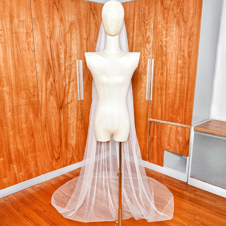 Modern minimalist cathedral length simple pencil edge wedding veil featuring a thin stitched hemline.