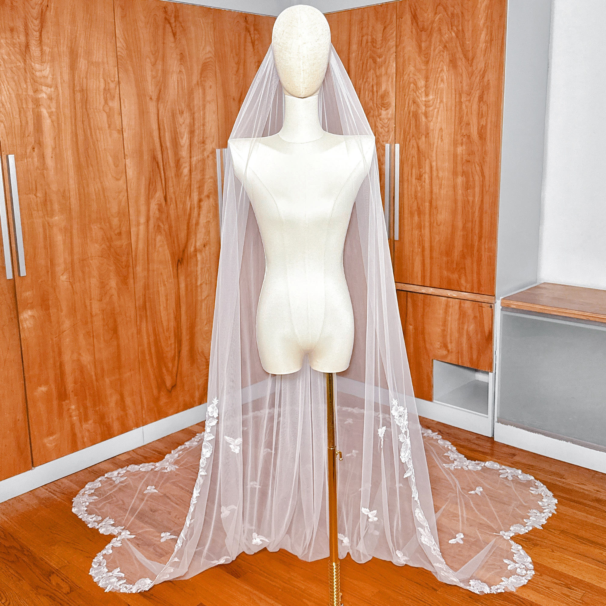 Front view of a Scalloped Lace Edge Royal Cathedral Veil displayed on a mannequin.