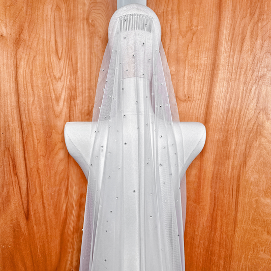 Cathedral length scattered rhinestone mantilla wedding veil with shimmering details.