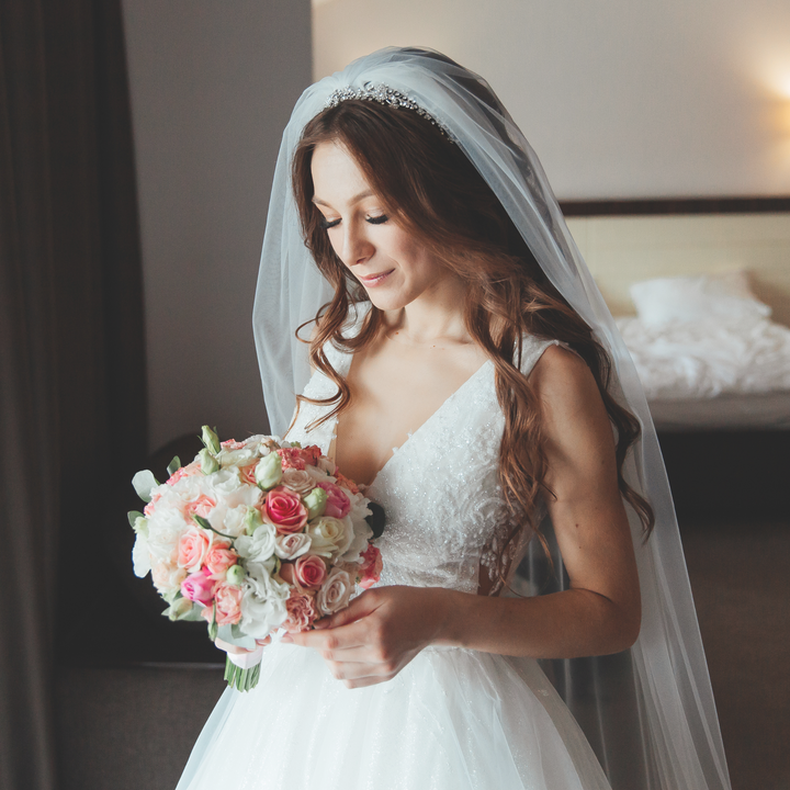 Close-up of the simple one-tier cathedral length wedding veil.