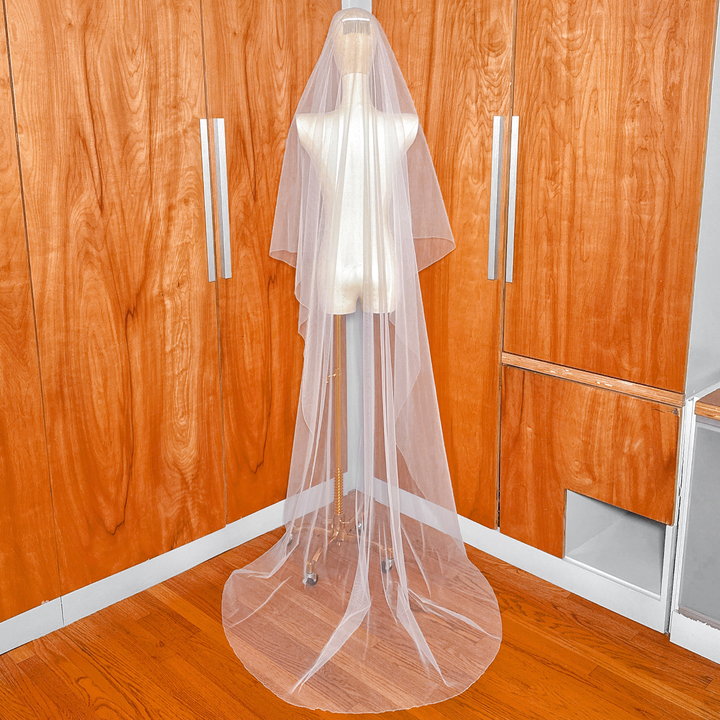 Back view of a simple two tier bridal veil with pencil edge showing chapel length cascade.