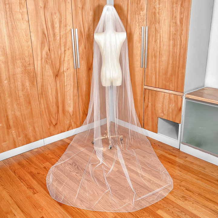 Single tier pencil edge wedding veil in cathedral length displayed on a bridal mannequin.
