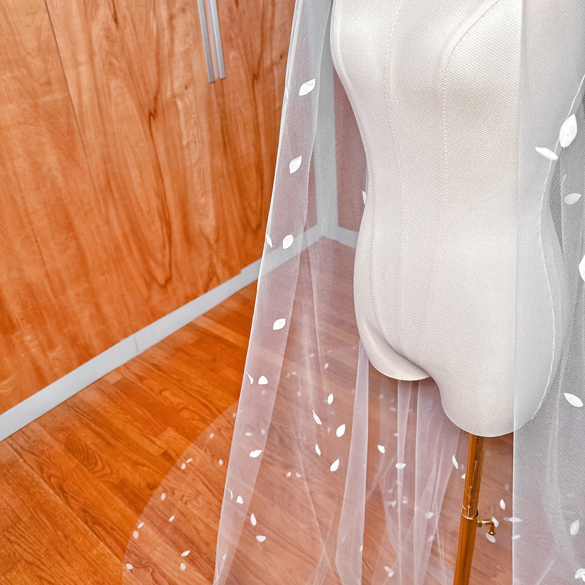 Detailed texture of silk petals a long cathedral length 3D bridal veil.