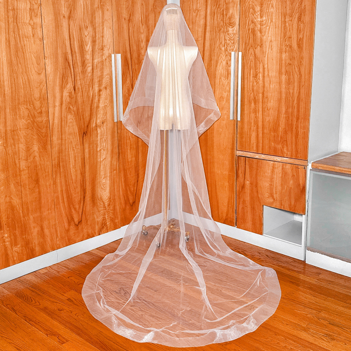 Back view of a 3 inch horsehair trim two tier wedding veil in cathedral length with a sheer blusher layer.
