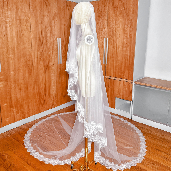 Side profile of a cathedral length Two Tier Chantilly Lace Wedding Veil showing the layering of the two tiers.