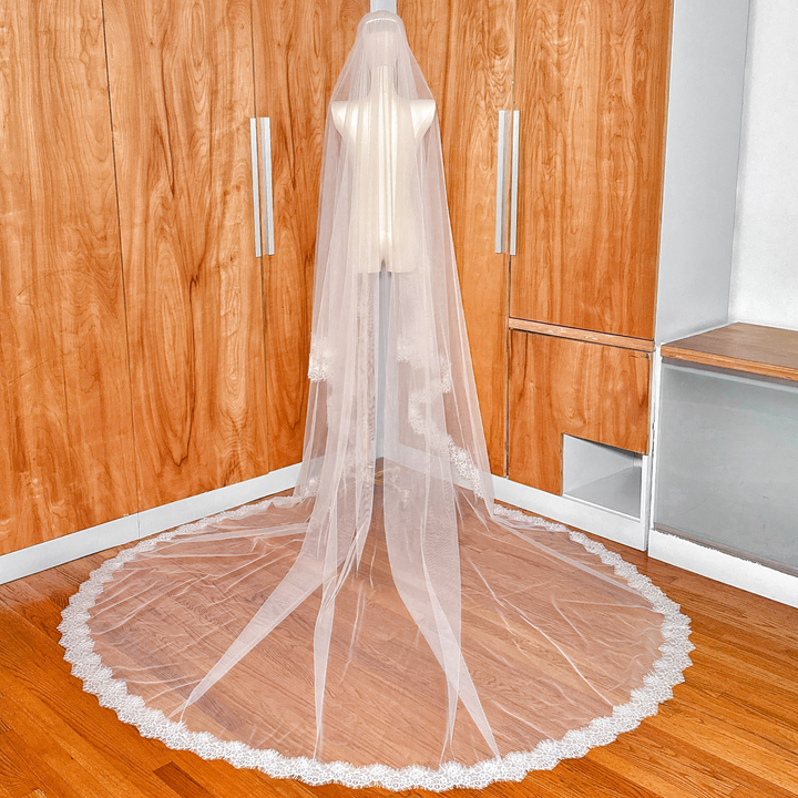 Soft bridal tulle and Chantilly lace details of a Two Tier Wedding Veil in cathedral length.