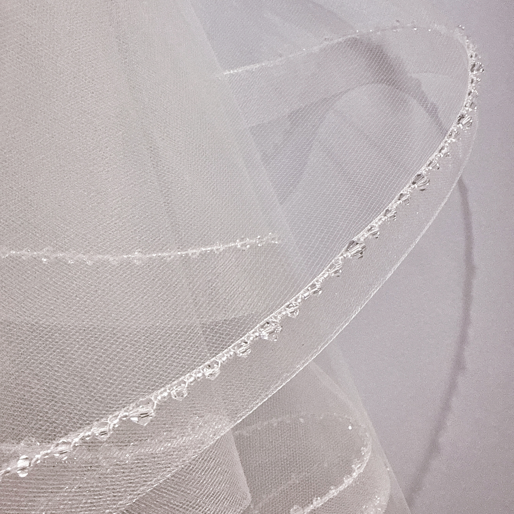 Close-up of the crystal edge detailing on a two tier horsehair veil.
