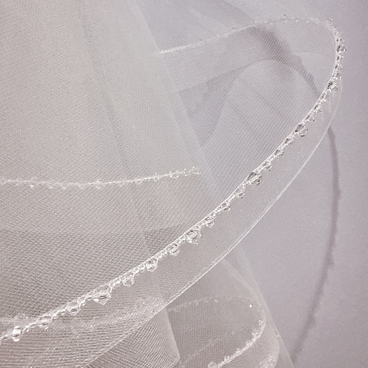 Close-up of the crystal edge detailing on a two tier horsehair veil.