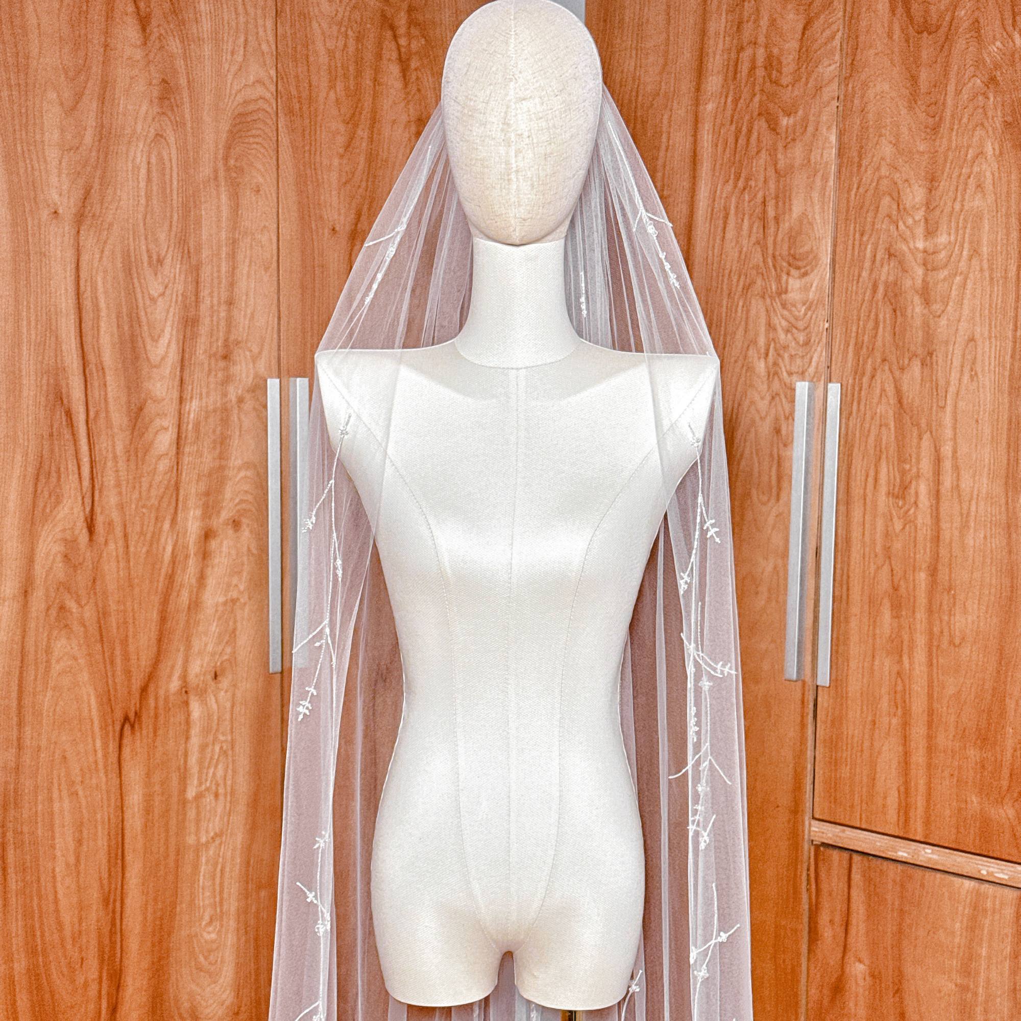 White cathedral length 3D floral embroidered veil with crystals and hand-sewn petals.